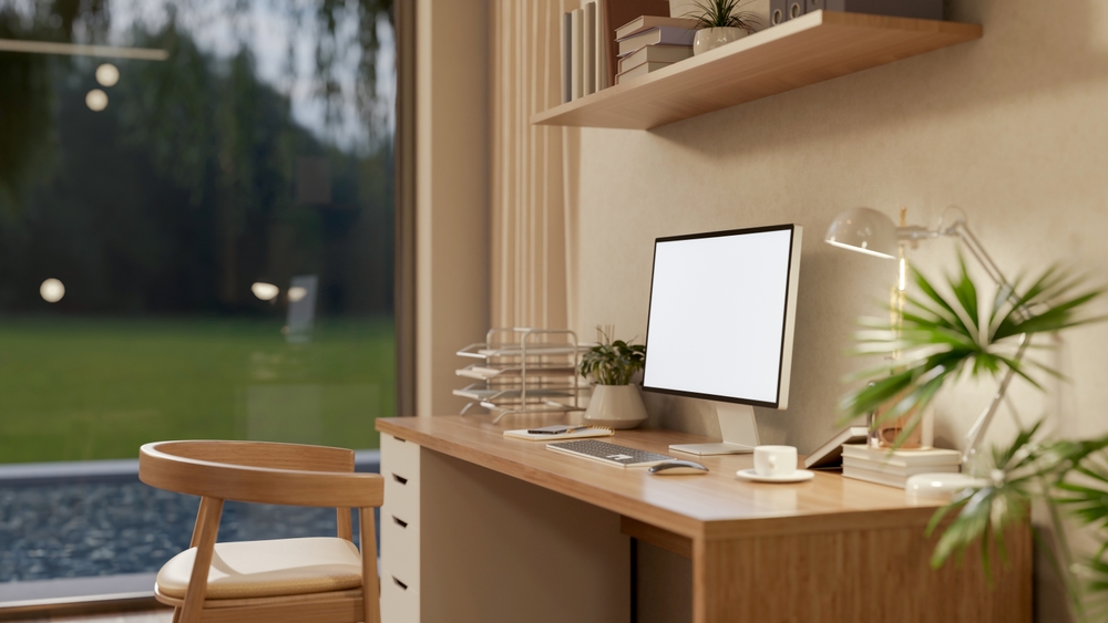 white,screen,computer,on,wooden,desk,under,hanging,display,shelf