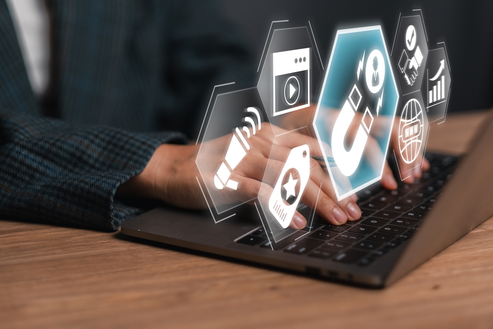 hands,typing,on,a,laptop,with,digital,marketing,icons,,illustrating